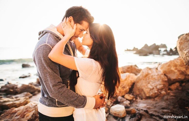 Romantic couple holding wallpaper