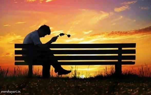 Sad boy sitting alone in love