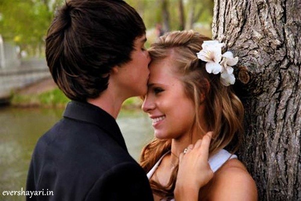 Boy kiss on girl forehead 