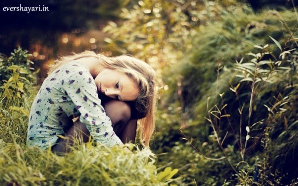 Alone Sad Girl Sitting On Grass